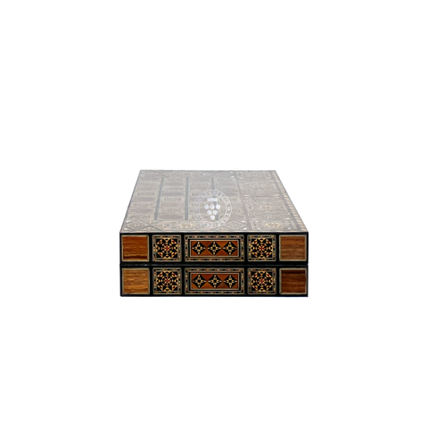 Side view of the closed Silk Road wooden backgammon case, showing its compact size